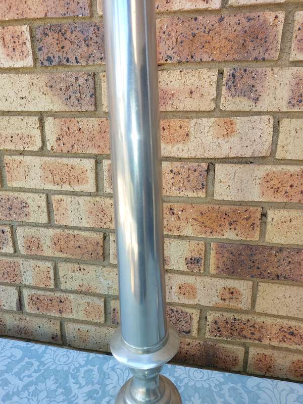 TWO ART DECOR ALUMINUM ALLOY 106 CENTIMETRES IN HEIGHT CANDLE STANDS
