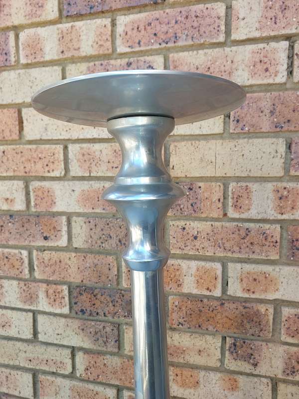 TWO ART DECOR ALUMINUM ALLOY 106 CENTIMETRES IN HEIGHT CANDLE STANDS
