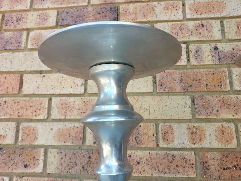 TWO ART DECOR ALUMINUM ALLOY 106 CENTIMETRES IN HEIGHT CANDLE STANDS