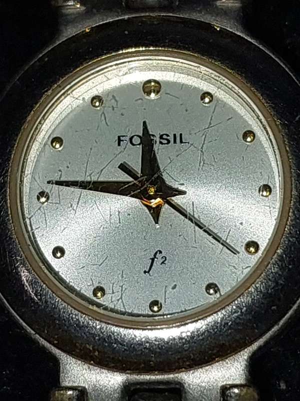 TWO VINTAGE FOSSIL WATCHES SOLD AS IS NOT TESTED.