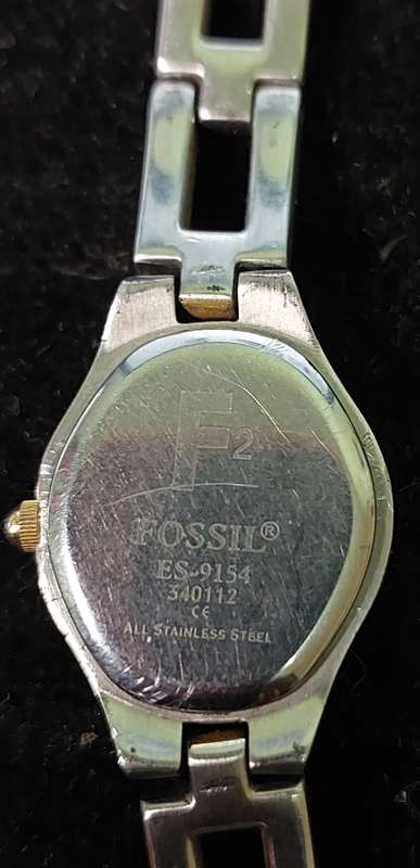 TWO VINTAGE FOSSIL WATCHES SOLD AS IS NOT TESTED.
