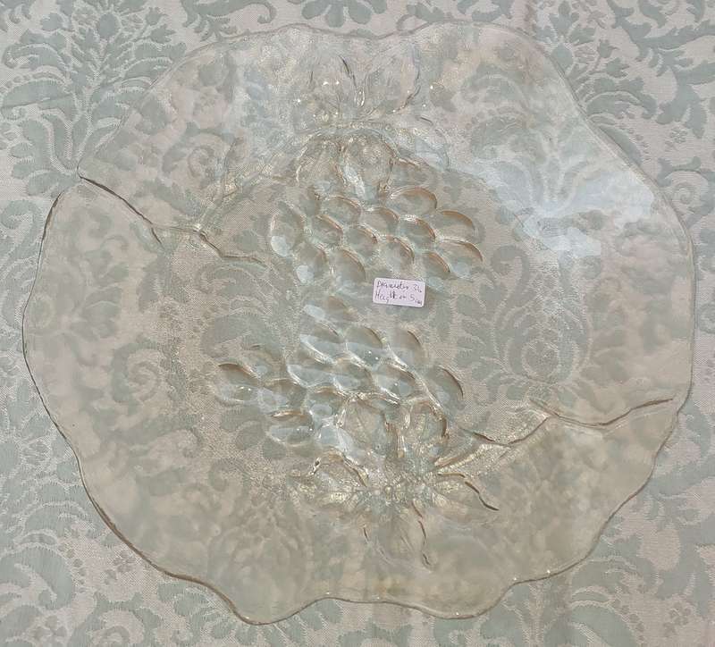 AN ART DECOR ROUND GLASS PLATTER WITH A GRAPE VINE DESIGN SOLD AS IS