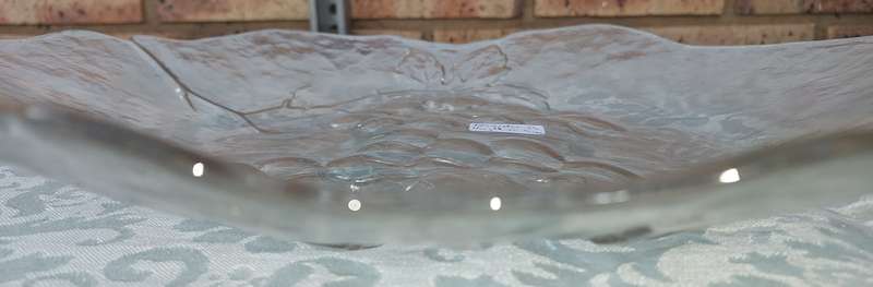AN ART DECOR ROUND GLASS PLATTER WITH A GRAPE VINE DESIGN SOLD AS IS