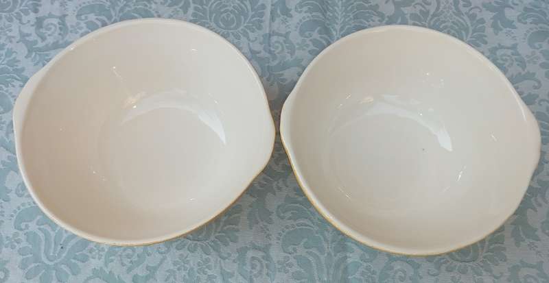 A PAIR TAN CERAMIC SERVING BOWLS