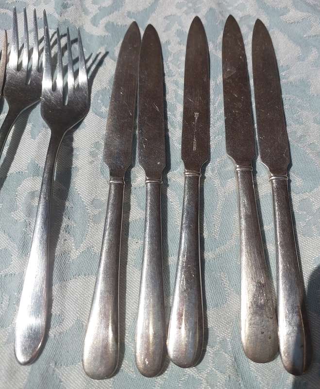A COLLECTION OF S/S CUTLERY SOLD AS IS