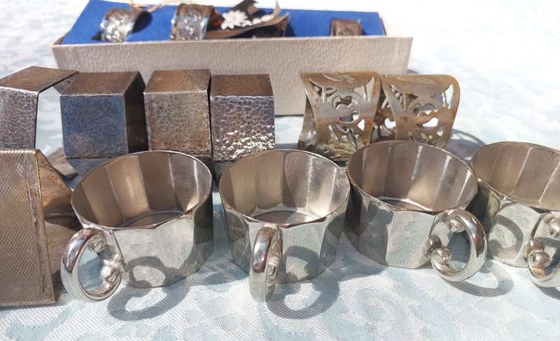 A VINTAGE COLLECTION OF NAPKIN RINGS SOLD AS IS