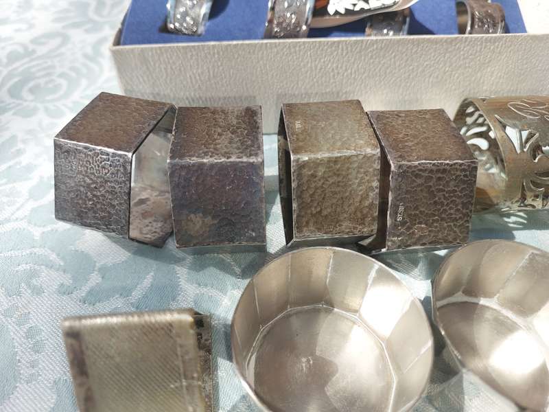 A VINTAGE COLLECTION OF NAPKIN RINGS SOLD AS IS