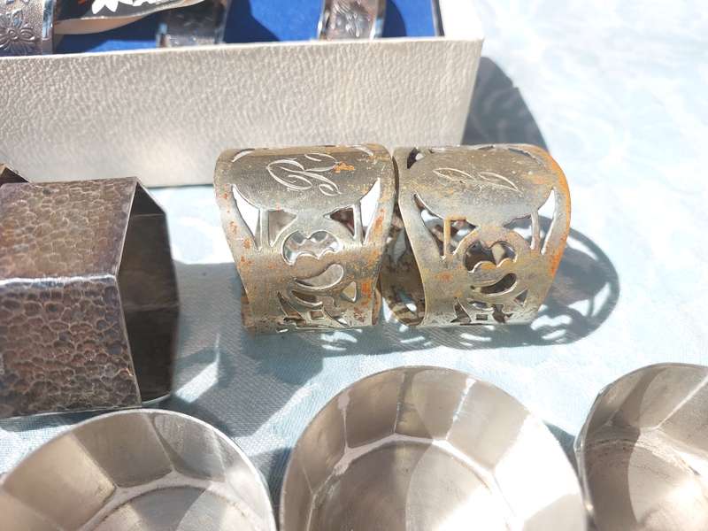 A VINTAGE COLLECTION OF NAPKIN RINGS SOLD AS IS