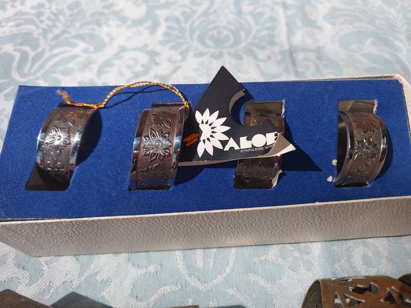 A VINTAGE COLLECTION OF NAPKIN RINGS SOLD AS IS