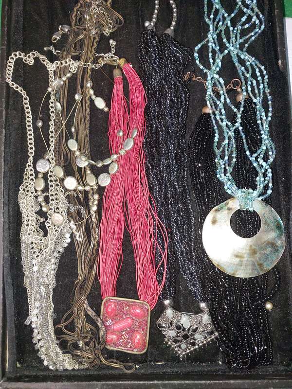 A COLLECTION OF COSTUME NECKLACES SOLD AS IS
