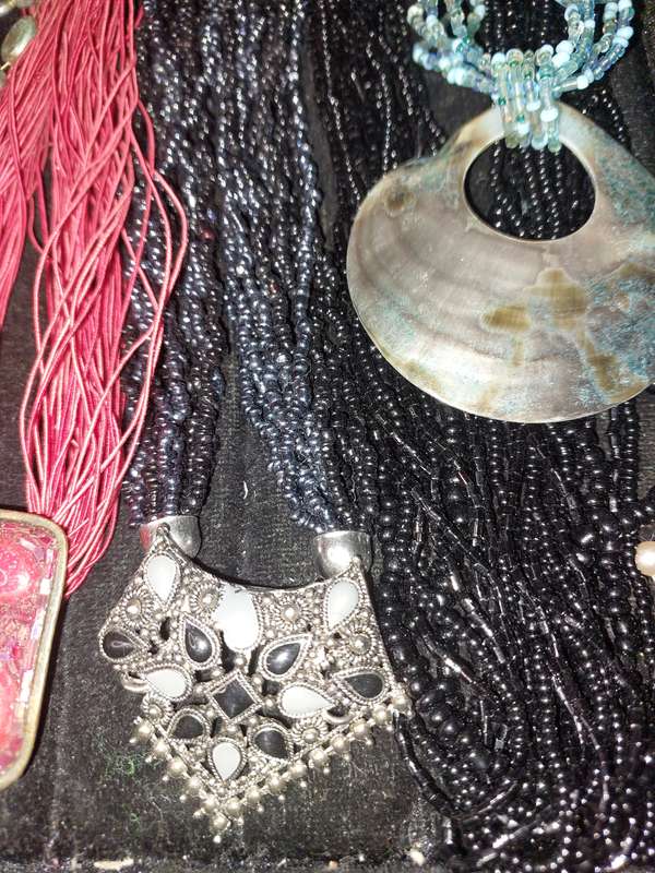 A COLLECTION OF COSTUME NECKLACES SOLD AS IS