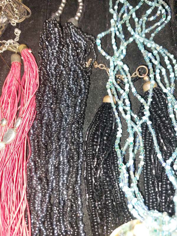 A COLLECTION OF COSTUME NECKLACES SOLD AS IS