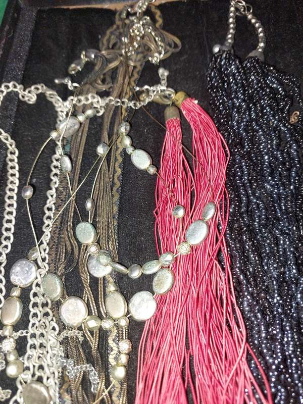 A COLLECTION OF COSTUME NECKLACES SOLD AS IS