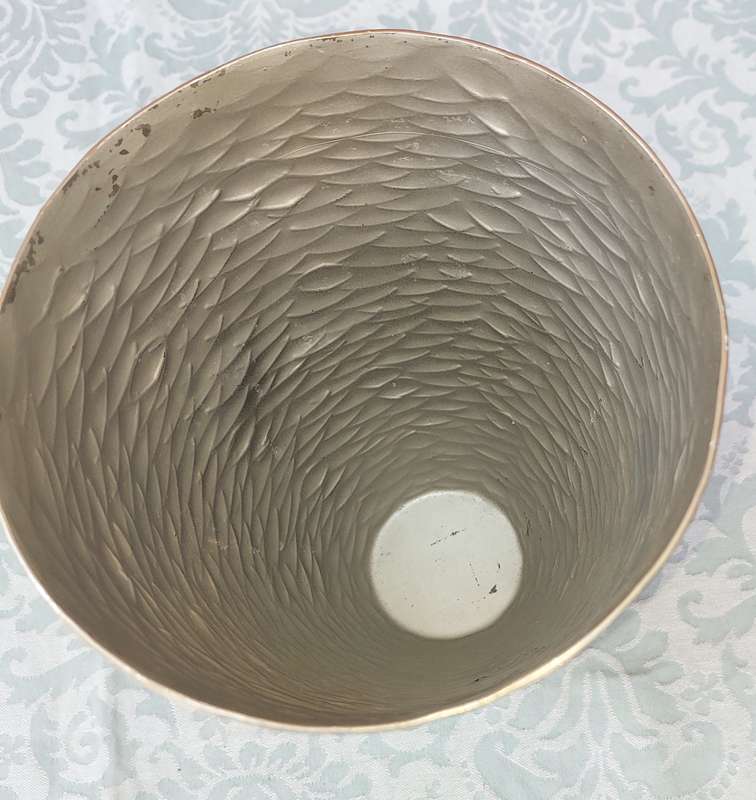 A FISH SCALE PATTERNED STEEL VASE