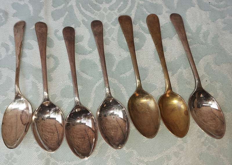 A VINTAGE COLLECTION OF TEASPOONS SOLD AS IS