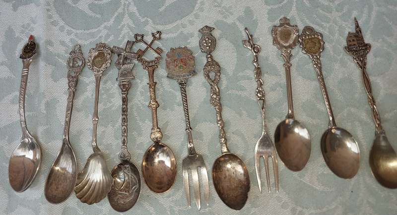 A COLLECTION OF SPOONS SOLD AS IS