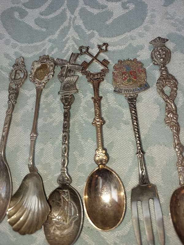 A COLLECTION OF SPOONS SOLD AS IS