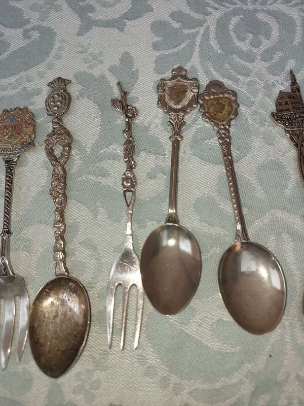 A COLLECTION OF SPOONS SOLD AS IS
