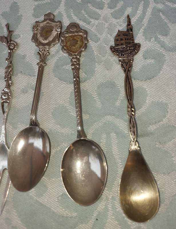A COLLECTION OF SPOONS SOLD AS IS