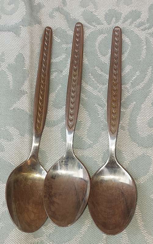 A SET OF 3 STAINLESS STEEL SPOONS