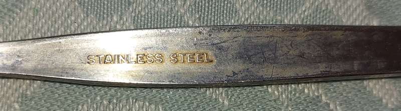 A SET OF 3 STAINLESS STEEL SPOONS