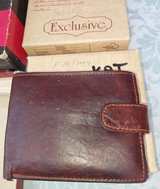 A LEATHER WALLETS AND A SET OF GROOMING BRUSHES