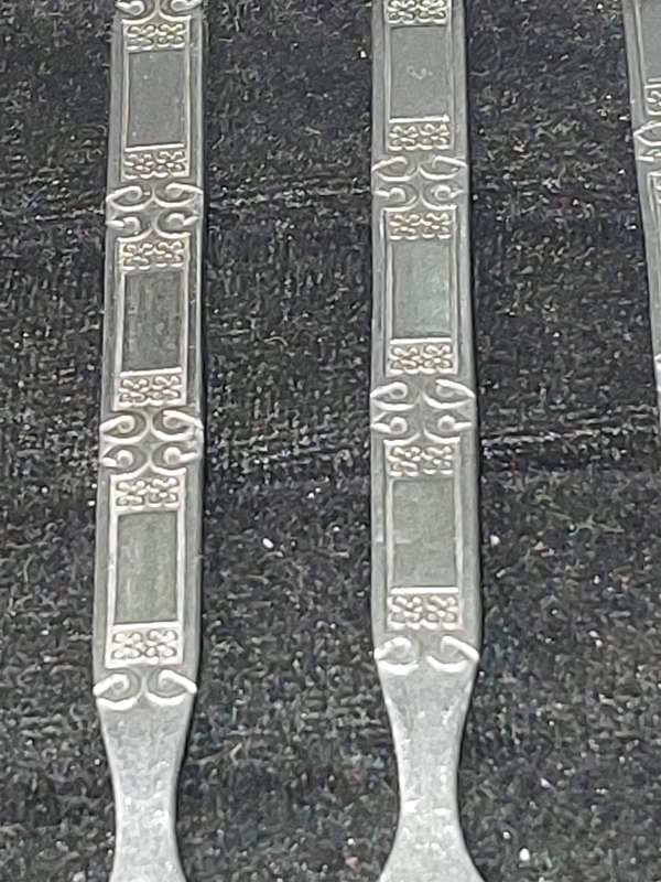 A SET OF 12 VINTAGE STAINLESS STEEL CAKE FORKS