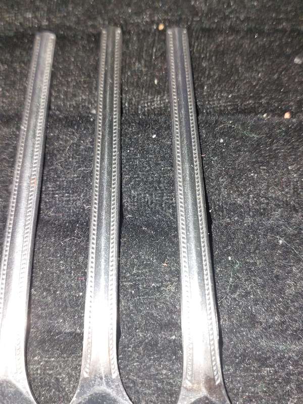 A SET OF 7 STAINLESS STEEL BELLERINA TWIST CAKE FORKS