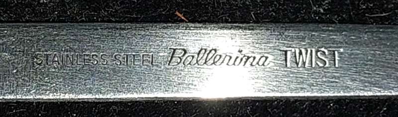 A SET OF 7 STAINLESS STEEL BELLERINA TWIST CAKE FORKS