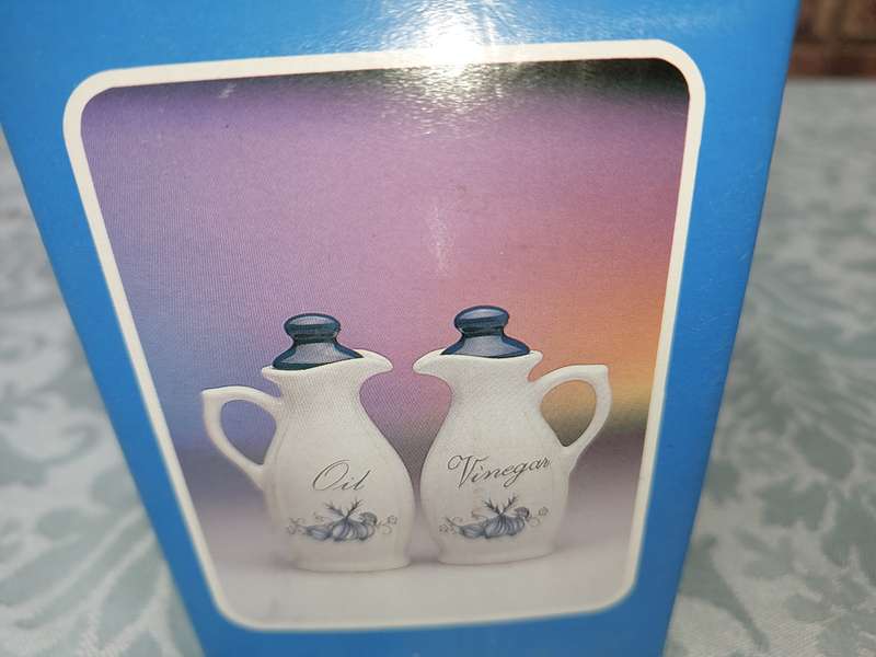 A STONEWARE  OIL AND VINEGAR SET BLUE ONION DESIGN