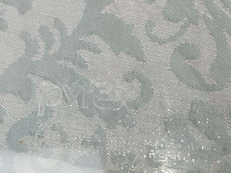 A PYREX OVEN PROOF AND MICROWAVE USE CASSEROLE SOLD AS IS