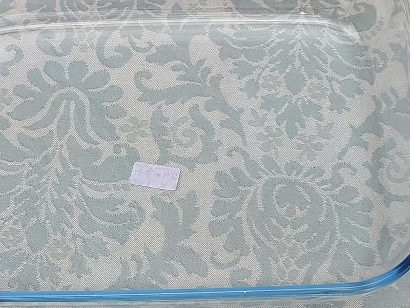 A PYREX OVEN PROOF AND MICROWAVE USE CASSEROLE SOLD AS IS