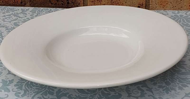 A WOOLWORTHS ROUND PLATTER MADE IN ITALY PORCELAIN