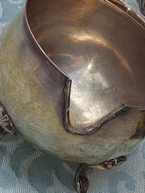 AN ANTIQUE TEA JUG, A SUGAR AND MILK SET