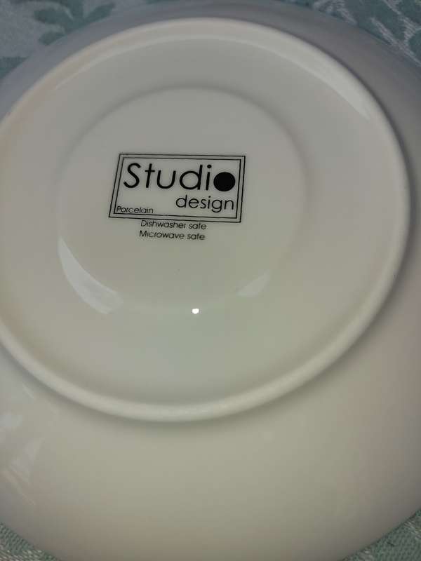 A COLLECTION OF 9 STUDIO WHITE PORCELAIN SAUCERS