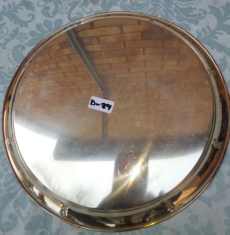 A STAINLESS STEEL SERVING TRAY SOLD A