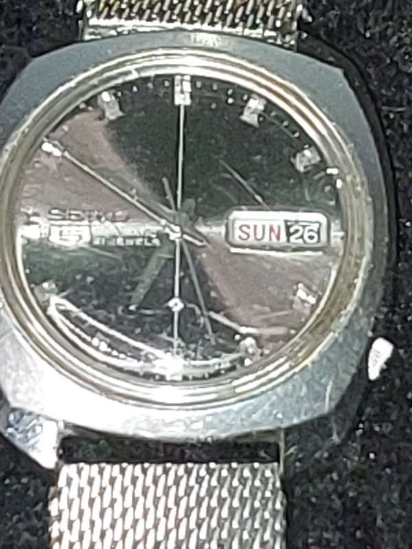 A VINTAGE SEIKO 5 AUTOMATIC STAINLESS STELL JAPAN 6119-7080T AD IN WORKING CONDITION SOLD AS IS