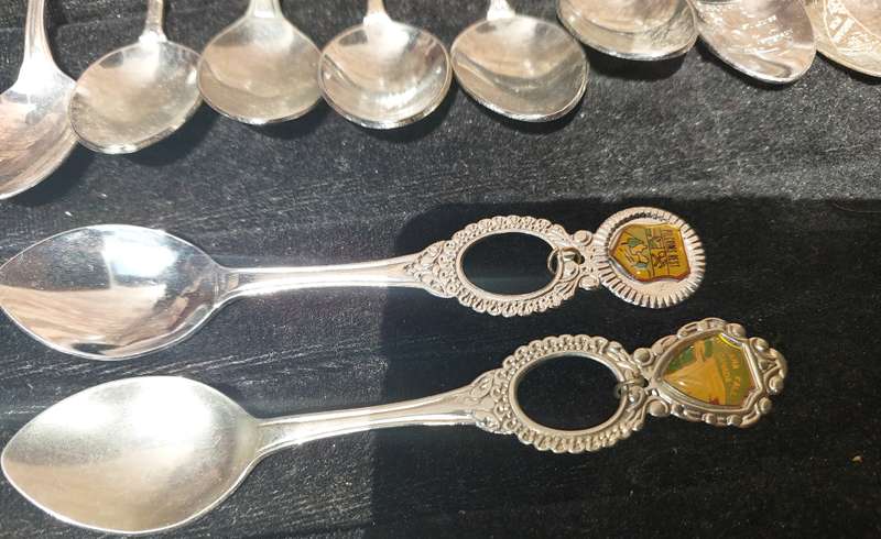 A COLLECTION OF 15 ORNATE MEMORABILIA SPOON