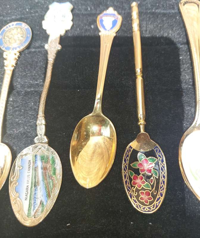 A VINTAGE COLLECTION GOLD PLATED MEMORABILIA SPOONS