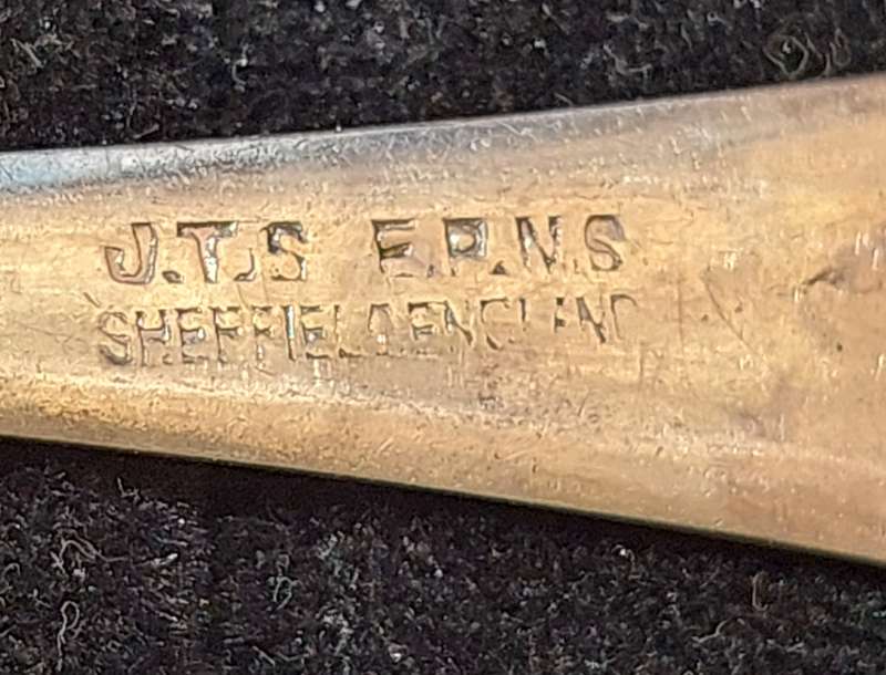 AN ANTIQUE COLLECTION EPNS SPOONS SOLD AS IS