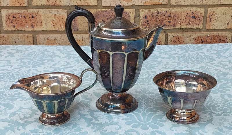 AN ANTIQUE TEA JUG SET MADE IN SHEFFIELD ENGLAND