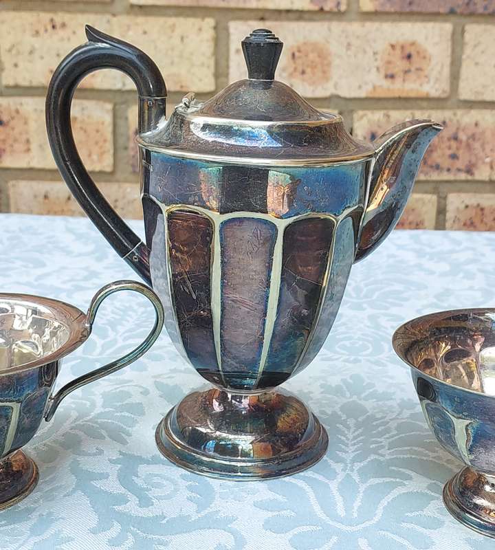 AN ANTIQUE TEA JUG SET MADE IN SHEFFIELD ENGLAND