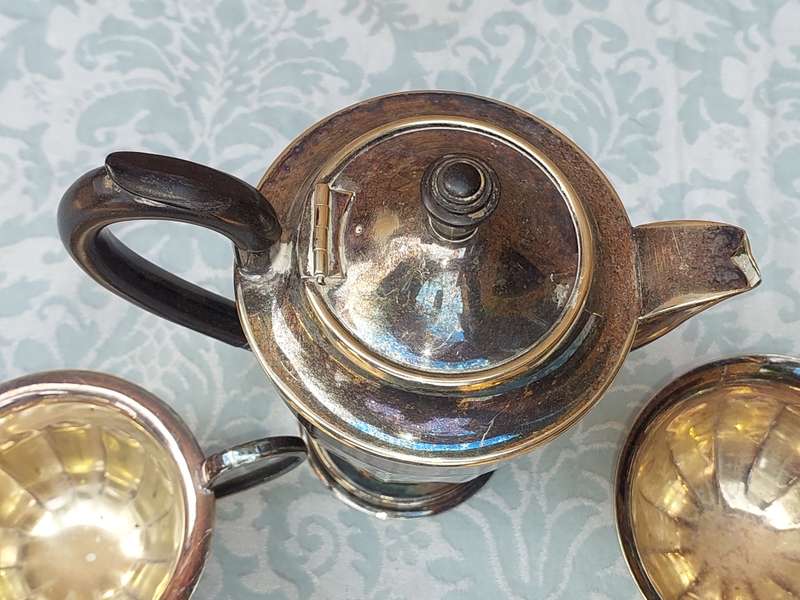 AN ANTIQUE TEA JUG SET MADE IN SHEFFIELD ENGLAND