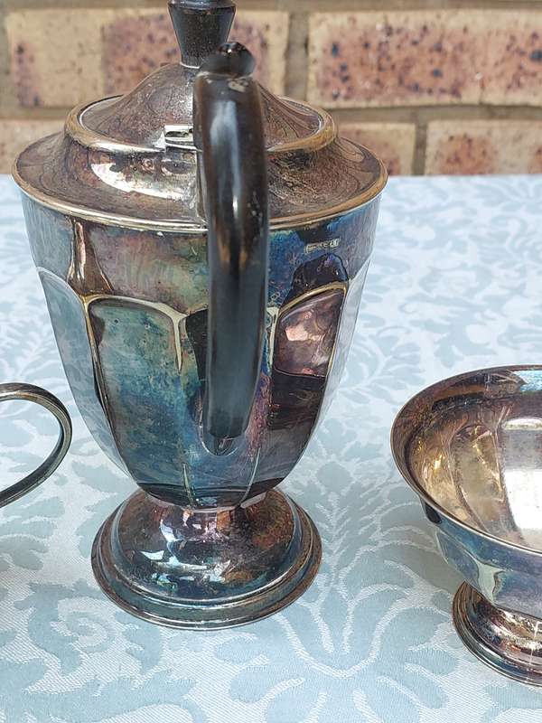 AN ANTIQUE TEA JUG SET MADE IN SHEFFIELD ENGLAND