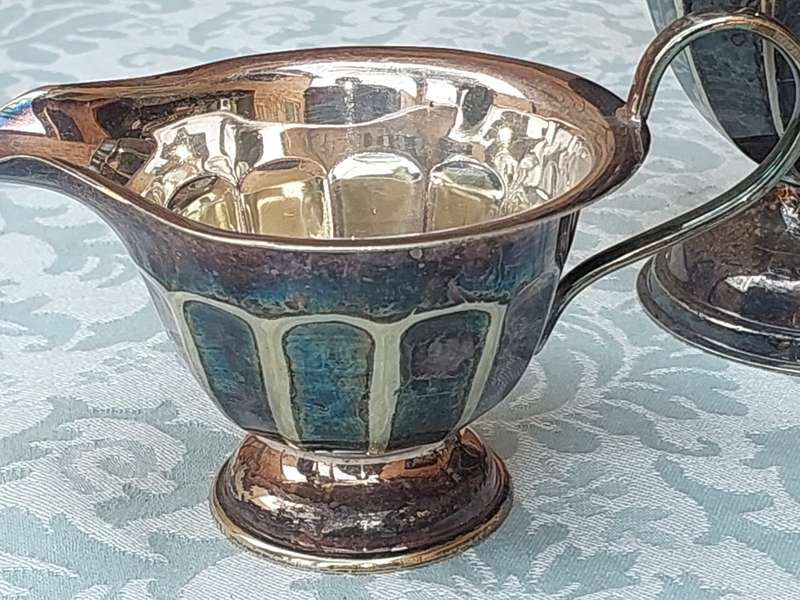 AN ANTIQUE TEA JUG SET MADE IN SHEFFIELD ENGLAND