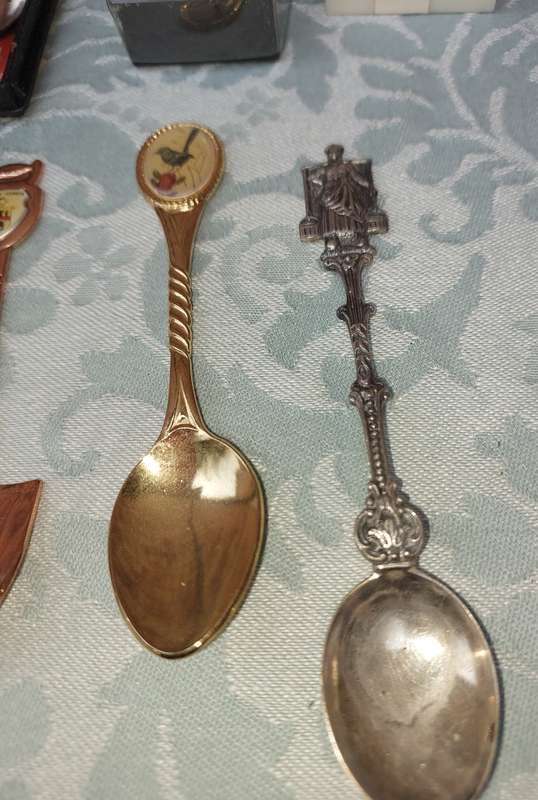 A COLLECTION OF MEMORABILIA SPOONS