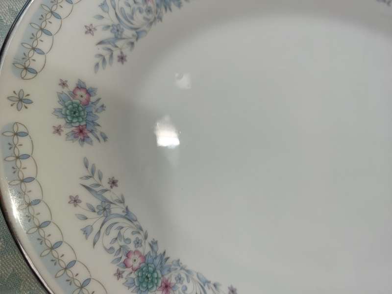 A VINTAGE PORCELAIN OVAL SHAPED WITH A SILVER INLAY PLATTER