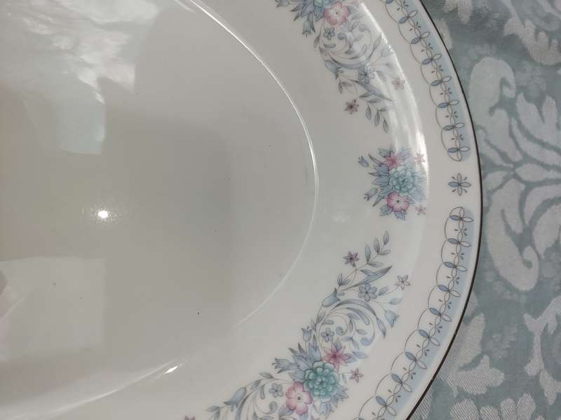 A VINTAGE PORCELAIN OVAL SHAPED WITH A SILVER INLAY PLATTER
