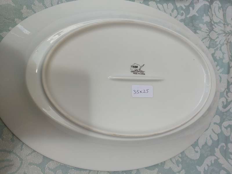 A VINTAGE PORCELAIN OVAL SHAPED WITH A SILVER INLAY PLATTER
