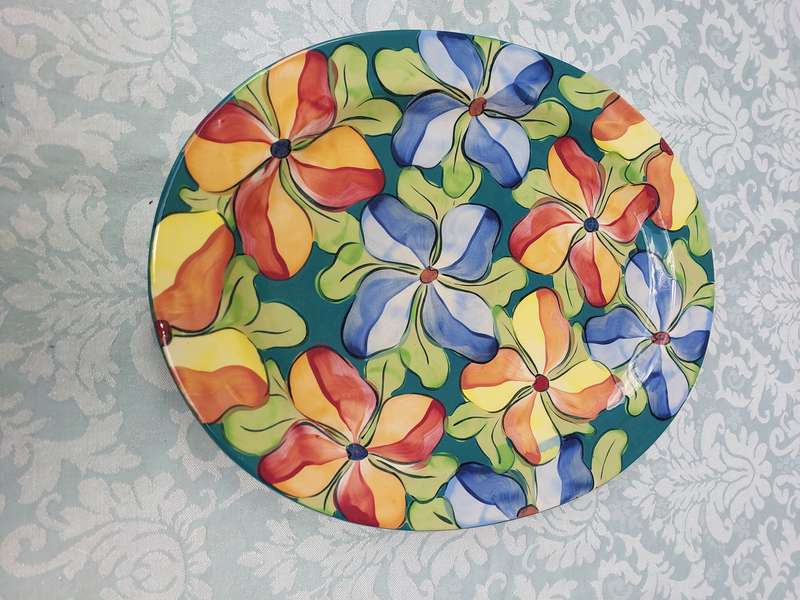 AN OVAL PORCELAIN FLORAL PATTERN SERVING PLATTER